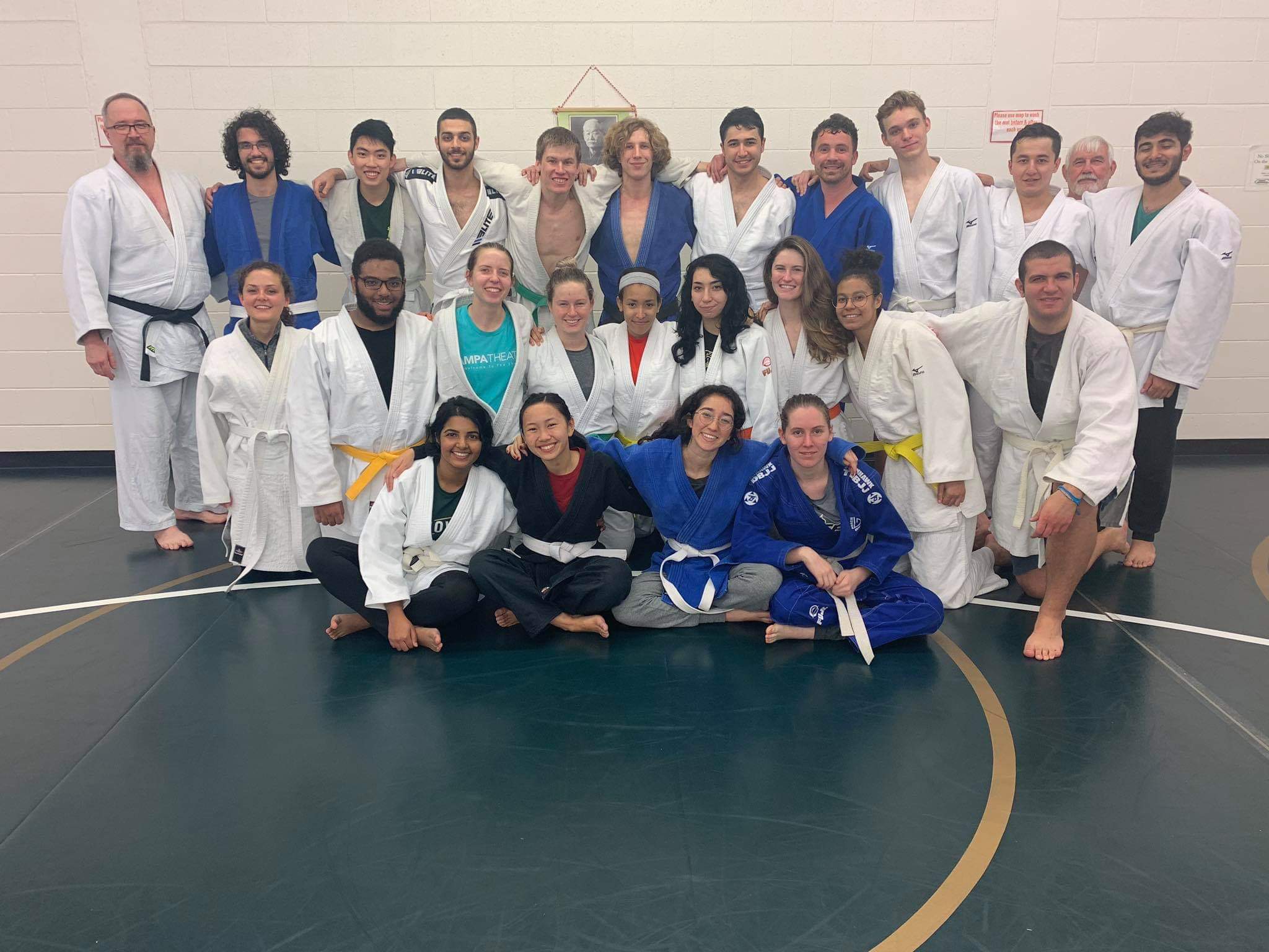 A group of members of the USF Judo Club.  LaRoyce Covington Jr is in the middle row, second from the left, wearing the traditional judogi tied with a yellow belt